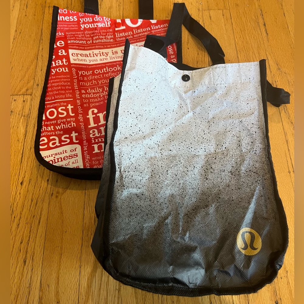 bundle of 1 small white and black Lululemon tote and 1 small red Lululemon tote